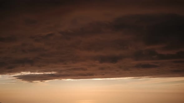 Airplane Flying Between the Clouds