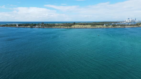 Travelling fast over the water from Wave break Island to the Gold Coast seaway with the open parklan