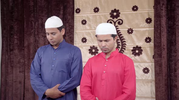 Muslim men performing Namaz rituals