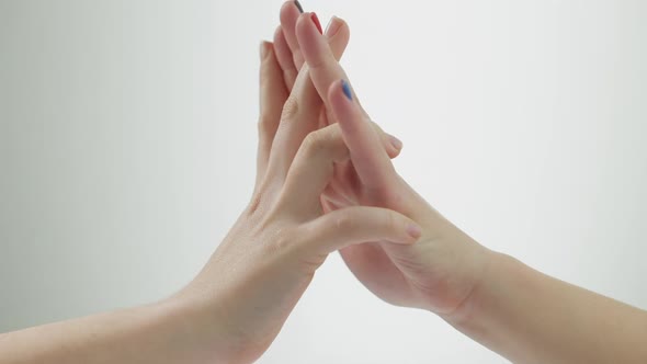 Closeup Young Male and Female Hands Touching at White Background