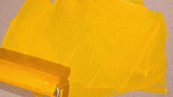 Abstract Brushstrokes of Yellow Paint Brush Roller Applied Isolated on a Gray Background