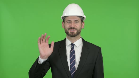 Ambitious Engineer Waving Hand Sign and Talking Against Chroma Key