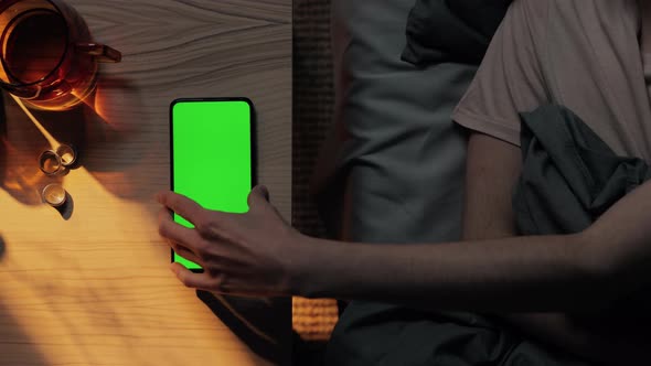 Woman in Bed Taking From Table Mobile with Green Screen