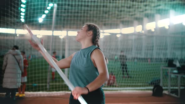 Pole Vaulting - the Sportswoman Is Configuring To Jump and Starting To Run