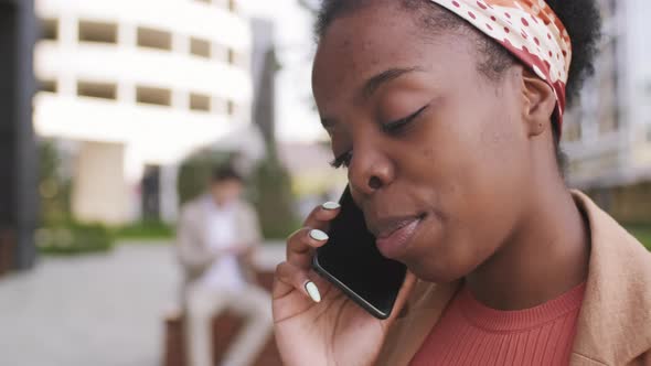  Close Up of Black Woman Talking on Mobile Phone