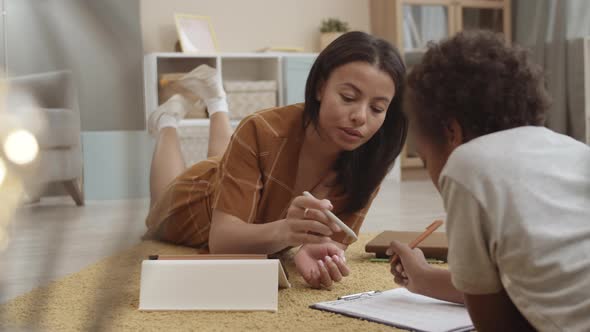 Boy Doing Homework with Mom