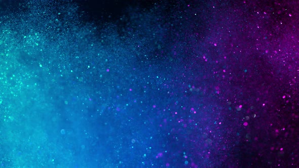 Super Slow Motion Shot of Colored Glitter Background alt