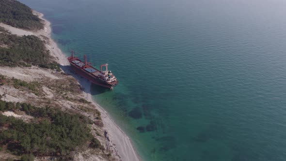 The Ship Ran Aground. Environmental Pollution at Sea. Aerial View. Grounded Ship. Drone Footage