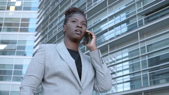 Serious Business Lady Standing Near Office Buildings