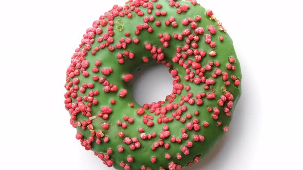 Bright Tasty Doughnut with Green Candy Glaze Slowly Rotation