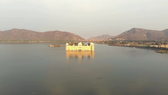 Jal Mahal unique beauty amidst the vast Sagar Lake, reflected on the water surface in Jaipur, India