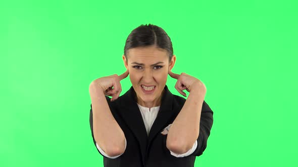 Girl Covers Her Ears, Too Loud. Green Screen