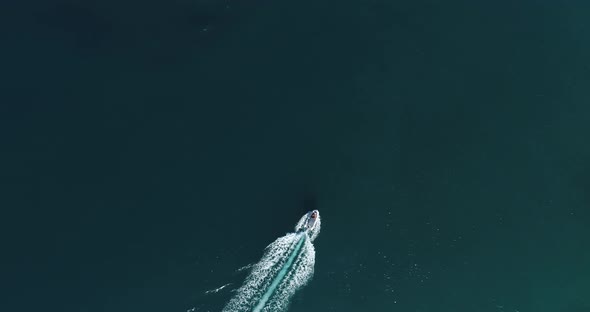 Aerial Top View of a White Pleasure Boat on a Summer Day