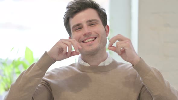 Portrait of Happy Man Dancing in Office