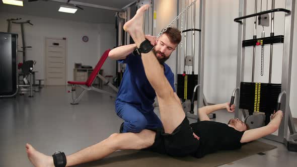 Athlete Male Patient in Clinic Sport Physical Therapy Concept