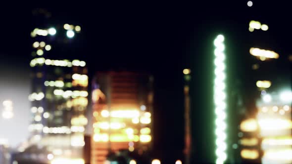 Blurred Cityscape Background Scene at Night alt