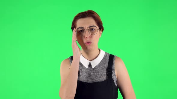 Portrait of Funny Girl in Round Glasses Is Listens Attentively While Sympathizing, Green Screen