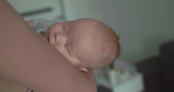 Cute Baby Born Sleeping on Mother's Hands