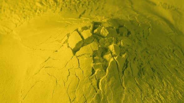 Crumbling Yellow Powder Material Closeup Shot