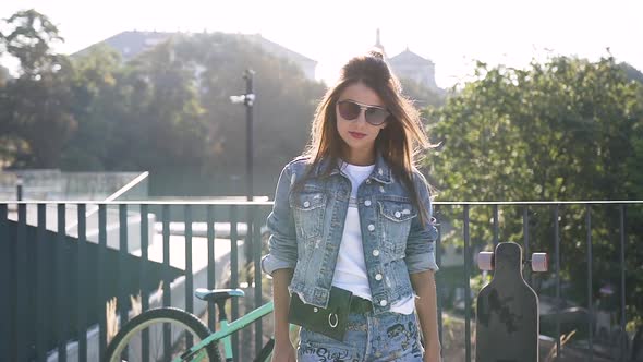 Beautiful Brunette Girl Posing on the Street in Denim Jacket, Stylish Shorts