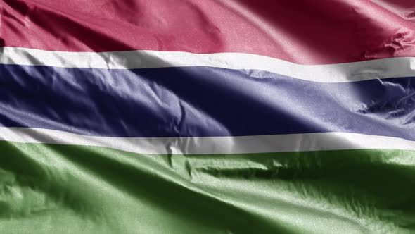 Gambia textile flag waving on the wind. 10 seconds loop.