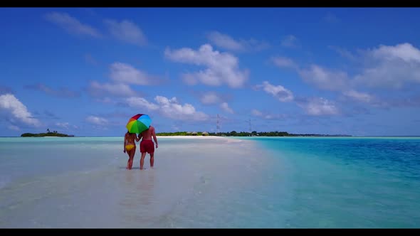 Romantic couple suntan on luxury shore beach holiday by blue ocean with white sand background of the