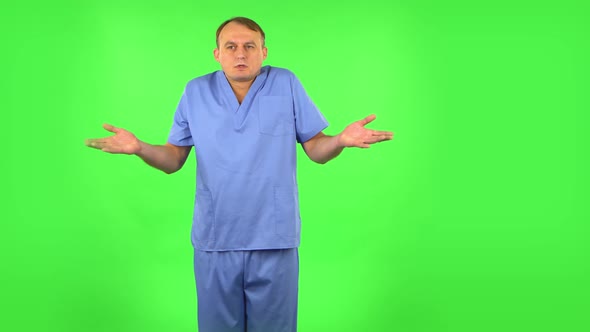 Upset Man Shrugs and Shakes Her Head Negatively. Green Screen