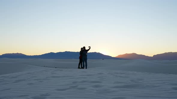 Two people taking a selfie in the white sands national park, New Mexico