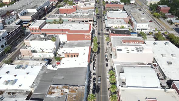 Slow aerial down the start of East 7th Avenue in Ybor City, Tampa, Florida