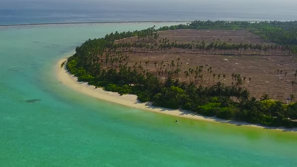 Aerial drone texture of tourist beach by blue lagoon with sand background