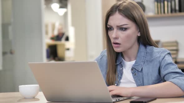 Aweful Creative Woman in Shock Working on Laptop