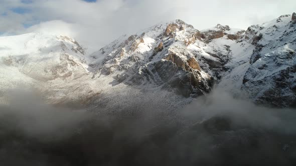 Foggy Mountains Peak In Snowy