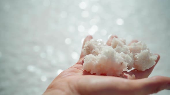 Womans Hand Holding Crystallized Salt Natural Mineral Formation