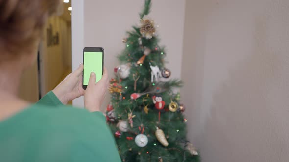 Mobile Phone Camera Used By A Retired Widow In Taking Photo Of Beautiful Christmas Tree In The House