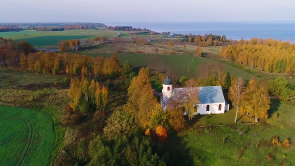 Aerial view of an isolated church in the middle of a forest, Estonia.