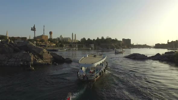 Boats on the Nile river in Aswan at sunset