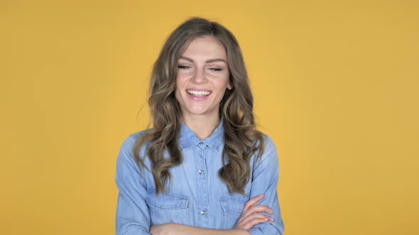 Yes, Young Girl Shaking Head To Accept Isolated on Yellow Background