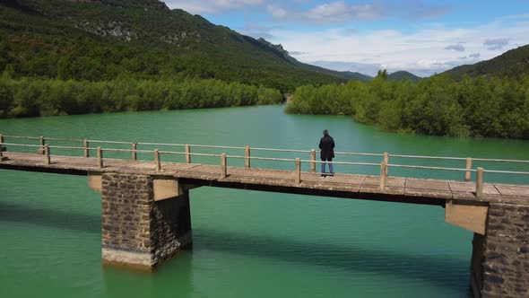 Man Standing In The Bridge Over The Reservoir (Reverse)