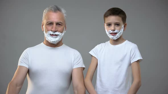 Happy Senior Male and Little Boy in Shaving Foam Crossing Hands on Chest, Fun