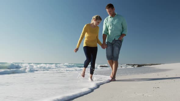 Couple in love enjoying free time on the beach together