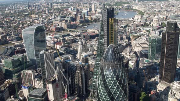 London city aerial helicopter flight urban skyline financial banking