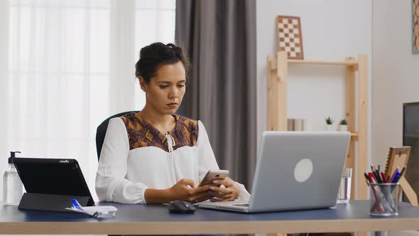 Bored Woman Browsing on Smartphone