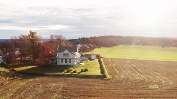 Lonely White Farm House Near Ostersund, Sweden Field During Bright Sunlight. 4K Drone.