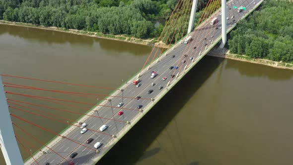 Modern cable stayed bridge and car traffic on background. Highway traffic jam. Aerial View