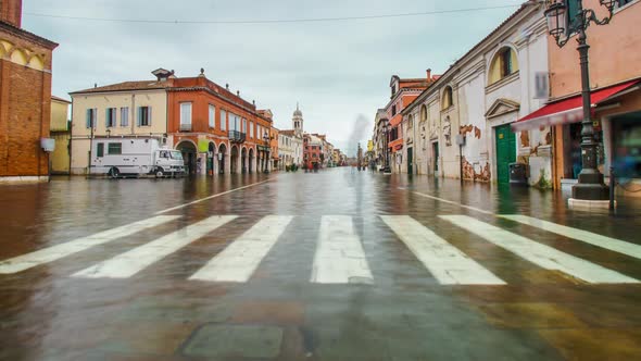 Street of the City Flooded with Water in Timelapse with People Walking