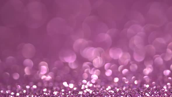 Purple glitter festive defocused lights background. Brilliant background for Ramadan and Eid holiday
