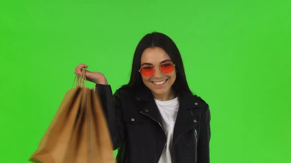 Happy Woman Showing Thumbs Up After Shopping