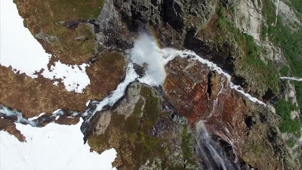 Aerial top-down footage of picturesque tall waterfall in Norway, aerial footage