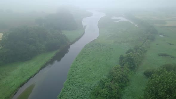 River Otter from the sky. Fog and mist is in the air. England has many beautiful nature parks and re