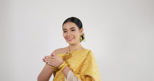 Portrait of Thai woman salute of respect in traditional costume of thailand